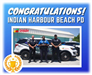 Puzzle Box Academy presented the Police with a trophy for winning the police vehicle wrap contest
